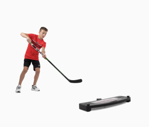 A hockey player using a puck rebounder to practice passing.